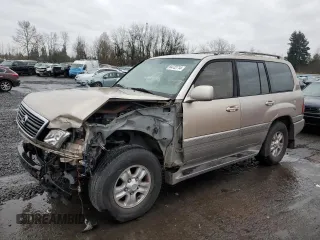 1999 Lexus LX 470 with VIN JT6HT00WXX0070590, listed as a Copart auction lot 84722714 with 313,715 mi miles and Salvage Title. Bid and sale history available at DreamBid. Image 1.