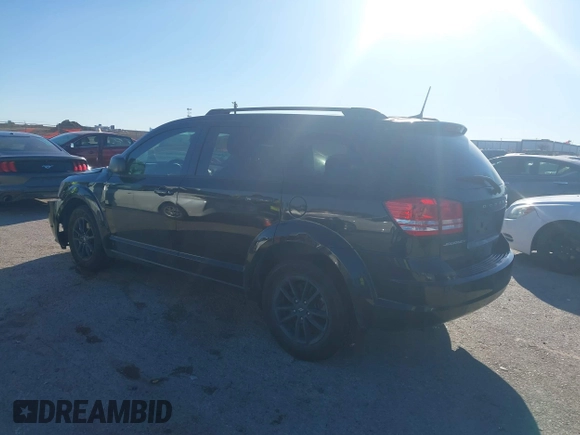 2020 Dodge Journey SE Value with VIN 3C4PDCAB7LT277627, listed as a IAAI auction lot 41729887 with 67,220 mi miles and . Bid and sale history available at carsss.com. Image 3.