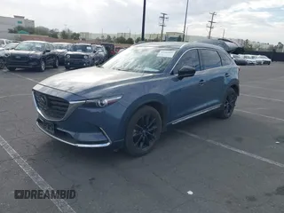 2021 Mazda CX-9 Grand Touring with VIN JM3TCADY1M0519288, listed as a IAAI auction lot 41186094 with 50,701 mi miles and . Bid and sale history available at DreamBid. Image 2.