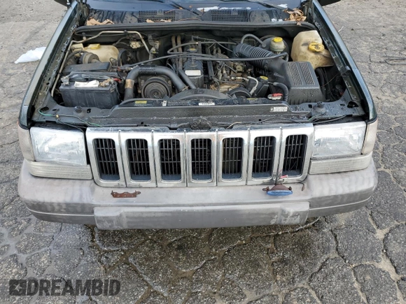 1996 Jeep Grand Cherokee with VIN 1J4EZ58S9TC148692, listed as a Copart auction lot 87730075 with Not provided miles and Salvage title. Bid and sale history available at DreamBid. Image 12.