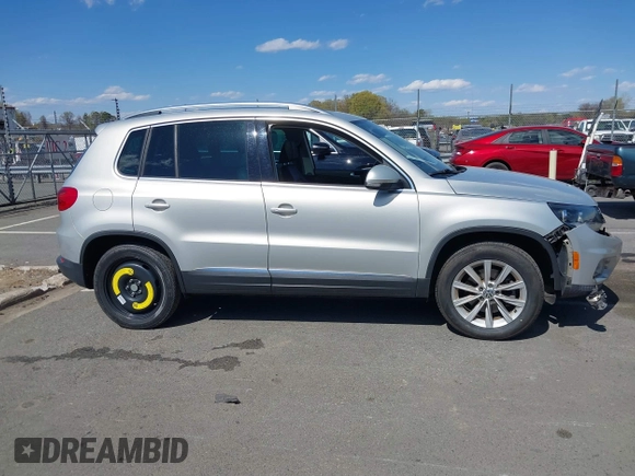 2015 Volkswagen Tiguan SE with VIN WVGAV7AX0FW544218, listed as a IAAI auction lot 41897418 with 97,235 mi miles and . Bid and sale history available at DreamBid. Image 14.