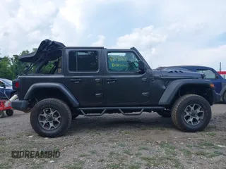 2020 Jeep Wrangler Unlimited Sport S with VIN 1C4HJXDN7LW113735, listed as a IAAI auction lot 42639884 with 48,736 mi miles and . Bid and sale history available at DreamBid. Image 13.