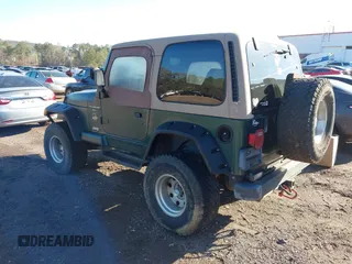 2000 Jeep Wrangler Sahara with VIN 1J4FA59S2YP734290, listed as a IAAI auction lot 41874866 with 201,036 mi miles. Bid and sale history available at carsss.com. Image 3.