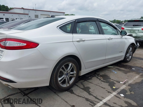 2016 Ford Fusion Titanium Hybrid with VIN 3FA6P0RU3GR190355, listed as a IAAI auction lot 42384309 with 157,172 mi miles and . Bid and sale history available at DreamBid. Image 13.