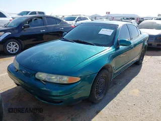 1999 Oldsmobile Alero GL z VIN 1G3NL52T0XC354966, wystawiony jako IAAI lot #42259258 z przebiegiem Nie podano mil oraz . Historia ofert i sprzedaży dostępna na DreamBid. Obrazek 17.