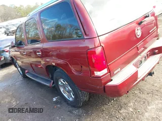 2003 Cadillac Escalade z VIN 1GYEC63T53R146068, wystawiony jako IAAI lot #41634405 z przebiegiem 272 263 mil mil oraz . Historia ofert i sprzedaży dostępna na DreamBid. Obrazek 3.