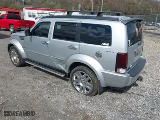 2011 Dodge Nitro Heat with VIN 1D4PU4GKXBW598683, listed as a IAAI auction lot 41958182 with 167,114 mi miles. Bid and sale history available at carsss.com. Image 3.