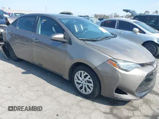 2018 Toyota Corolla L z VIN 5YFBURHEXJP845530, wystawiony jako IAAI lot #42184549 z przebiegiem 113 379 mil mil oraz . Historia ofert i sprzedaży dostępna na DreamBid. Obrazek 1.