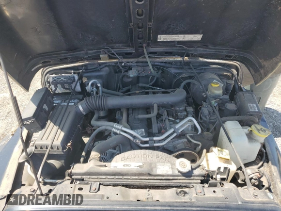 2002 Jeep Wrangler Sport with VIN 1J4FA49S02P721457, listed as a Copart auction lot 61726855 with 76,191 mi miles and Salvage title. Bid and sale history available at DreamBid. Image 12.