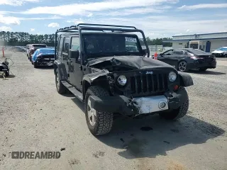 2012 Jeep Wrangler Unlimited Sahara with VIN 1C4HJWEG5CL205826, listed as a Copart auction lot 58222115 with 98,940 mi miles and Salvage title. Bid and sale history available at DreamBid. Image 14.