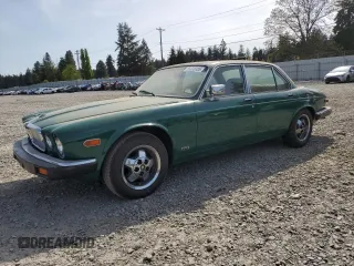 1984 Jaguar XJ z VIN SAJAV1343EC388553, wystawiony jako Copart lot #55335355 z przebiegiem 135 476 mil mil oraz Czysty tytuł • Clean title. Historia ofert i sprzedaży dostępna na DreamBid. Obrazek 1.