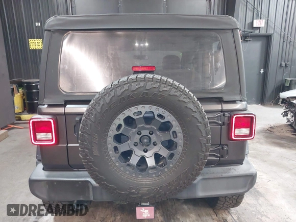 2021 Jeep Wrangler Sport S with VIN 1C4HJXAG2MW502452, listed as a IAAI auction lot 42031159 with 87,952 mi miles and . Bid and sale history available at DreamBid. Image 16.