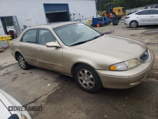 1998 Mazda 626 DX with VIN 1YVGF22C1W5762498, listed as a Copart auction lot 78283944 with 210,639 mi miles and Salvage Title. Bid and sale history available at carsss.com. Image 4.