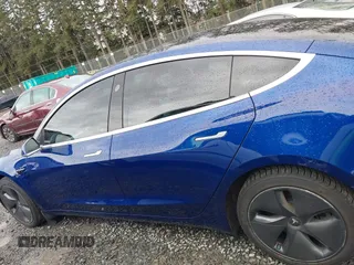 2019 Tesla Model 3 Long Range with VIN 5YJ3E1EB8KF512950, listed as a IAAI auction lot 41836349 with 55,607 mi miles and . Bid and sale history available at DreamBid. Image 14.