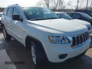 2012 Jeep Grand Cherokee Laredo with VIN 1C4RJFAG6CC279427, listed as a IAAI auction lot 41956034 with 86,689 mi miles. Bid and sale history available at carsss.com. Image 1.