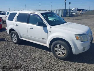 2008 Mercury Mariner with VIN 4M2CU91178KJ51960, listed as a IAAI auction lot 41982665 with 136,958 mi miles. Bid and sale history available at carsss.com. Image 1.