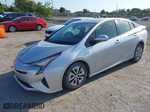 2017 Toyota Prius Two z VIN JTDKARFU8H3046058, wystawiony jako IAAI lot #42169692 z przebiegiem 79 226 mil mil oraz . Historia ofert i sprzedaży dostępna na DreamBid. Obrazek 2.