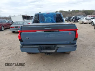 2023 Ford F-150 Lightning Pro with VIN 1FT6W1EVXPWG34958, listed as a IAAI auction lot 41732898 with 10,573 mi miles and . Bid and sale history available at DreamBid. Image 16.