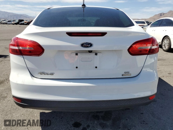 2018 Ford Focus SE with VIN 1FADP3FE4JL322857, listed as a Copart auction lot 58090025 with 58,148 mi miles and Clean title. Bid and sale history available at DreamBid. Image 6.