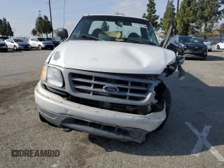 2000 Ford F-150 XL с VIN 1FTPF18L8YKA58312, выставлен на аукционе Copart как лот 45748355 с пробегом 200 263 миль миль и Списание • Salvage title. История ставок и продаж доступна на DreamBid. Изображение 5.