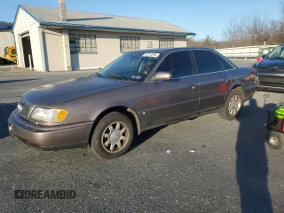 1995 Audi A6 z VIN WAUGA84A2SN055887, wystawiony jako Copart lot #85212394 z przebiegiem 254 307 mil mil oraz Tytuł czysty. Historia ofert i sprzedaży dostępna na DreamBid. Obrazek 1.
