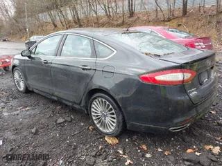 2013 Ford Fusion Titanium with VIN 3FA6P0K99DR340129, listed as a IAAI auction lot 41956835 with 105,730 mi miles. Bid and sale history available at carsss.com. Image 3.