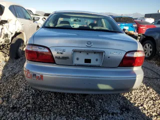 2001 Mazda 626 LX with VIN 1YVGF22C715241262, listed as a Copart auction lot 74259924 with 86,085 mi miles and Salvage Title. Bid and sale history available at carsss.com. Image 6.