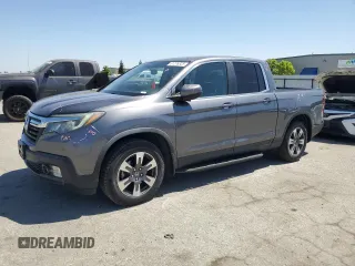 2019 Honda Ridgeline RTL-T with VIN 5FPYK2F68KB003907, listed as a Copart auction lot 61276325 with 59,612 mi miles and Salvage title. Bid and sale history available at DreamBid. Image 1.