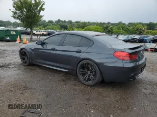 2015 BMW M6 z VIN WBS6C9C59FD467943, wystawiony jako Copart lot #63477904 z przebiegiem 80 186 mil mil oraz Szkody całkowita. Historia ofert i sprzedaży dostępna na DreamBid. Obrazek 2.