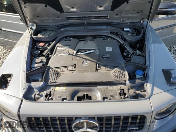 2023 Mercedes-Benz G 63 AMG z VIN W1NYC7HJ6PX478899, wystawiony jako Copart lot #69573004 z przebiegiem Nie podano mil oraz Szkoda całkowita • Salvage title. Historia ofert i sprzedaży dostępna na DreamBid. Obrazek 12.