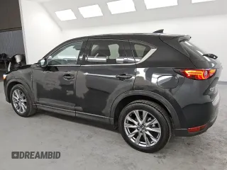 2021 Mazda CX-5 Grand Touring with VIN JM3KFBDM6M0487606, listed as a Copart auction lot 45399655 with 25,241 mi miles and Clean Title. Bid and sale history available at DreamBid. Image 2.