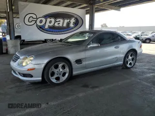 2005 Mercedes-Benz SL 500 with VIN WDBSK75F85F097668, listed as a Copart auction lot 61101455 with 87,462 mi miles and Salvage title. Bid and sale history available at DreamBid. Image 1.