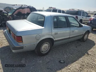 1989 Dodge Spirit z VIN 1B3BA46K1KF408949, wystawiony jako Copart lot #80767594 z przebiegiem 137 766 mil mil oraz Nie do naprawy. Historia ofert i sprzedaży dostępna na DreamBid. Obrazek 3.