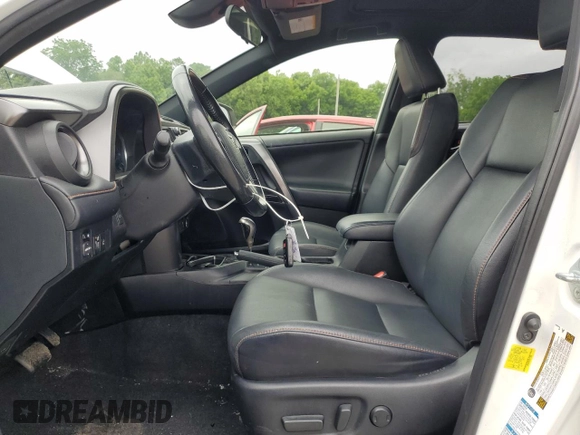 2018 Toyota RAV4 Hybrid SE with VIN JTMJJREV1JD172042, listed as a Copart auction lot 61418305 with 143,902 mi miles and Salvage title. Bid and sale history available at DreamBid. Image 7.