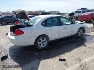 2000 Ford Taurus SE with VIN 1FAFP5327YA186258, listed as a IAAI auction lot 41795342 with 123,174 mi miles. Bid and sale history available at carsss.com. Image 4.