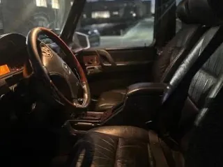2002 Mercedes-Benz G-Class with VIN WDCYR49E22X132146, listed as a Copart auction lot 50534225 with 208,917 mi miles and Salvage Title. Bid and sale history available at carsss.com. Image 5.
