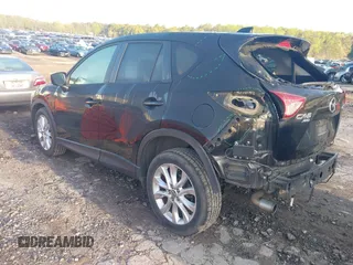 2015 Mazda CX-5 Grand Touring with VIN JM3KE4DY6F0513173, listed as a IAAI auction lot 41867030 with 93,770 mi miles. Bid and sale history available at carsss.com. Image 3.