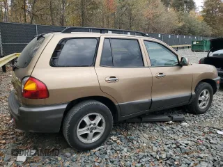 2001 Hyundai Santa Fe GLS with VIN KM8SC83D71U084837, listed as a Copart auction lot 77588984 with 102,585 mi miles and Salvage Title. Bid and sale history available at carsss.com. Image 3.