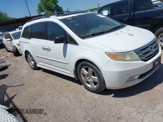 2011 Honda Odyssey Touring с VIN 5FNRL5H97BB083185, выставлен на аукционе IAAI как лот 42220579 с пробегом 9 999 миль миль и . История ставок и продаж доступна на DreamBid. Изображение 1.