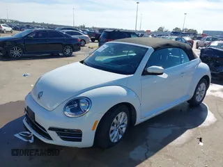 2019 Volkswagen Beetle S with VIN 3VW5DAAT0KM507437, listed as a IAAI auction lot 41380821 with 28,010 mi miles and . Bid and sale history available at DreamBid. Image 2.