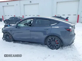 2023 Tesla Model Y Performance with VIN 7SAYGDEF0PF898181, listed as a IAAI auction lot 41577666 with 19,051 mi miles and . Bid and sale history available at DreamBid. Image 14.