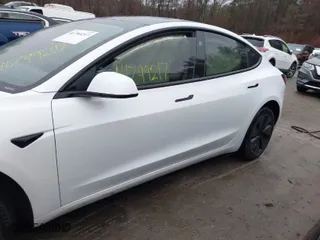 2024 Tesla Model 3 Long Range with VIN 5YJ3E1EB0RF812296, listed as a IAAI auction lot 41799217 with 6,990 mi miles. Bid and sale history available at carsss.com. Image 15.