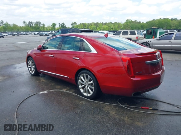 2013 Cadillac XTS Premium with VIN 2G61S5S34D9237236, listed as a IAAI auction lot 41994164 with 218,719 mi miles. Bid and sale history available at carsss.com. Image 3.