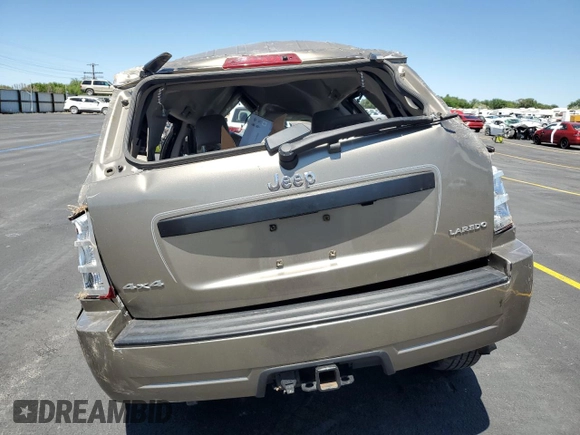 2005 Jeep Grand Cherokee Laredo z VIN 1J4HR48N65C517657, wystawiony jako Copart lot #58774685 z przebiegiem Nie podano mil oraz Szkoda całkowita • Salvage title. Historia ofert i sprzedaży dostępna na DreamBid. Obrazek 6.