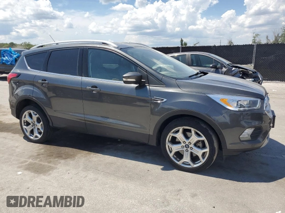 2019 Ford Escape Titanium z VIN 1FMCU9J96KUA65154, wystawiony jako Copart lot #63932325 z przebiegiem 117 963 mil mil oraz Czysty tytuł • Clean title. Historia ofert i sprzedaży dostępna na DreamBid. Obrazek 4.