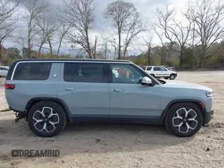 2024 Rivian R1S Adventure with VIN 7PDSGBBA1RN040036, listed as a IAAI auction lot 41694635 with 13,855 mi miles. Bid and sale history available at carsss.com. Image 14.