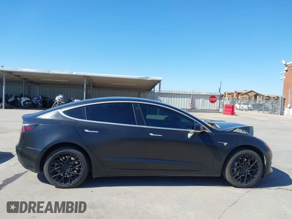 2020 Tesla Model 3 Standard Range Plus with VIN 5YJ3E1EA0LF597761, listed as a IAAI auction lot 41773918 with 89,957 mi miles. Bid and sale history available at carsss.com. Image 12.