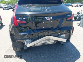 2024 Cadillac XT4 AWD Premium Luxury z VIN 1GYFZDR44RF144801, wystawiony jako IAAI lot #42646613 z przebiegiem 37 358 mil mil oraz . Historia ofert i sprzedaży dostępna na DreamBid. Obrazek 6.