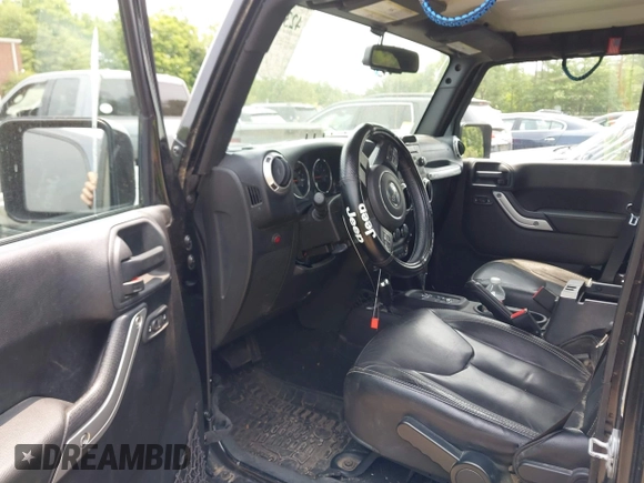 2015 Jeep Wrangler Unlimited Sahara with VIN 1C4HJWEG3FL661568, listed as a IAAI auction lot 42387810 with 140,927 mi miles and . Bid and sale history available at DreamBid. Image 5.
