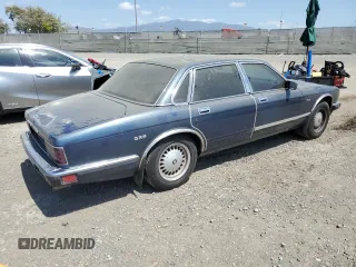 1992 Jaguar XJ with VIN SAJHY174XNC649368, listed as a Copart auction lot 50191454 with 99,553 mi miles and Salvage Title. Bid and sale history available at DreamBid. Image 3.